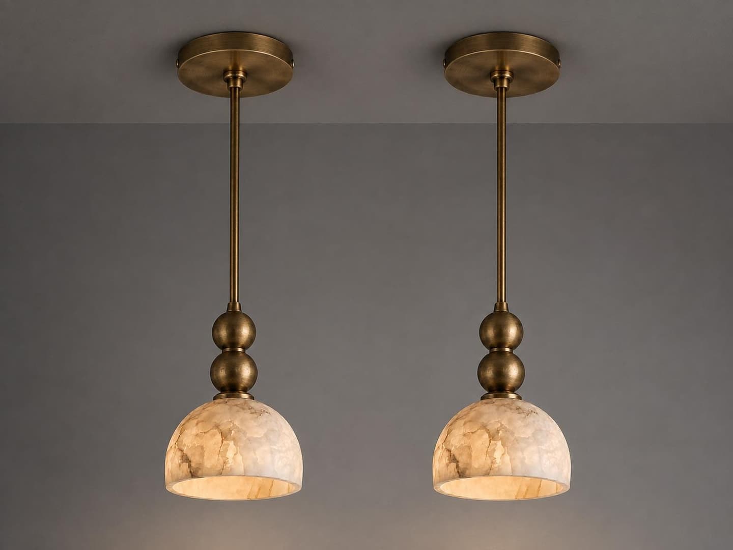 Alabaster globe pendant light on a slim brass stem — image 1 of 8